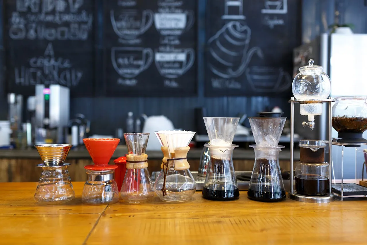 Coffee brewing pots in a line.